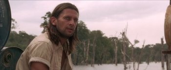 Movie still from “Anaconda” (1997), directed by Luis Llosa – A person with long brown hair; Close Up shot, Low angle