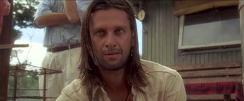 Movie still from “Anaconda” (1997), directed by Luis Llosa – A person with long hair; Close Up shot, Low angle