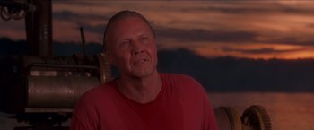 Movie still from “Anaconda” (1997), directed by Luis Llosa – A person wearing a red t - shirt; Close Up shot, Low angle