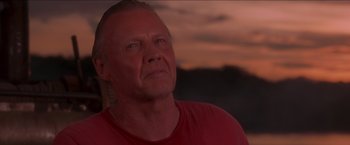 Movie still from “Anaconda” (1997), directed by Luis Llosa – A person wearing a red t - shirt; Close Up shot, Low angle
