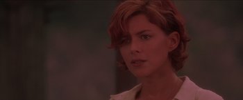 Movie still from “Anaconda” (1997), directed by Luis Llosa – A person with short red hair; Close Up shot, Over the shoulder angle