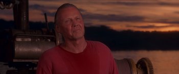 Movie still from “Anaconda” (1997), directed by Luis Llosa – A person sitting on a couch; Close Up shot, Low angle
