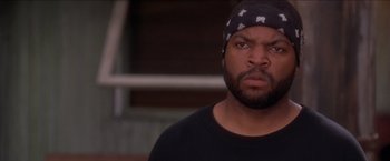 Movie still from “Anaconda” (1997), directed by Luis Llosa – A person wearing a hat; Close Up shot, Over the shoulder angle