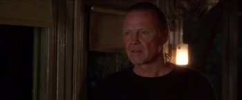 Movie still from “Anaconda” (1997), directed by Luis Llosa – A person wearing a black t - shirt; Close Up shot, Low angle