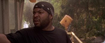 Movie still from “Anaconda” (1997), directed by Luis Llosa – A person with a bandana on; Close Up shot, Low angle