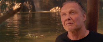 Movie still from “Anaconda” (1997), directed by Luis Llosa – A person near a body of water; Close Up shot, Low angle