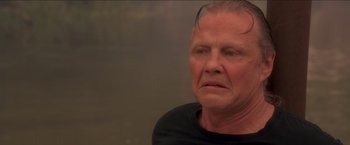 Movie still from “Anaconda” (1997), directed by Luis Llosa – An older man is looking into the distance; Close Up shot, Low angle