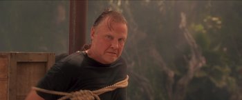 Movie still from “Anaconda” (1997), directed by Luis Llosa – A man with a rope around his neck; Close Up shot, Low angle