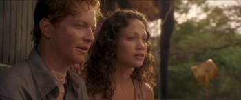 Movie still from “Anaconda” (1997), directed by Luis Llosa – A man and a woman standing next to each other; Close Up shot, Low angle