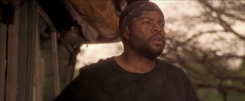 Movie still from “Anaconda” (1997), directed by Luis Llosa – A person wearing a hat; Close Up shot, Low angle