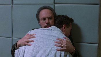 Movie still from “Analyze That” (2002), directed by Harold Ramis – A man is hugging another man in a towel; Close Up shot, Over the shoulder angle