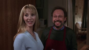 Movie still from “Analyze That” (2002), directed by Harold Ramis – A man and a woman standing next to each other in a kitchen; Close Up shot, Low angle