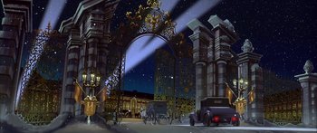 Movie still from “Anastasia” (1997), directed by Gary Goldman – An artistic painting of an old fashioned car driving through a gate; Extreme Wide shot, Low angle