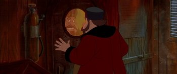 Movie still from “Anastasia” (1997), directed by Gary Goldman – A man is looking in the mirror at himself in a cartoon; Medium shot, Over the shoulder angle