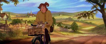Movie still from “Anastasia” (1997), directed by Gary Goldman – An animated woman riding a bike with a baby in a basket; Medium shot, Over the shoulder angle