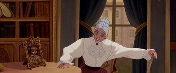 Movie still from “Anastasia” (1997), directed by Gary Goldman – A woman in a white shirt and a red skirt; Medium shot, Over the shoulder angle