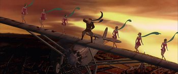 Movie still from “Anastasia” (1997), directed by Gary Goldman – A man standing on top of an airplane with two women; Wide shot, Low angle