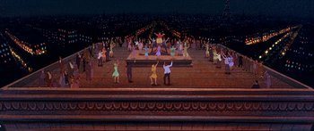 Movie still from “Anastasia” (1997), directed by Gary Goldman – A group of people are dancing on a stage; Extreme Wide shot, High angle