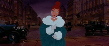 Movie still from “Anastasia” (1997), directed by Gary Goldman – A woman in a fur coat standing on the street; Medium shot, Over the shoulder angle