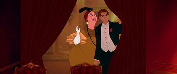 Movie still from “Anastasia” (1997), directed by Gary Goldman – A man and a woman in formal wear standing in front of a chair; Medium shot, Low angle