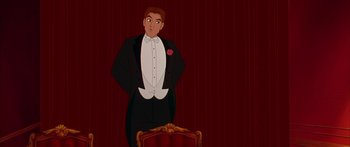 Movie still from “Anastasia” (1997), directed by Gary Goldman – A man in a tuxedo standing in front of a chair; Medium shot, Low angle
