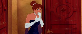 Movie still from “Anastasia” (1997), directed by Gary Goldman – A woman in a black dress and white gloves standing in front of a door; Close Up shot, Over the shoulder angle