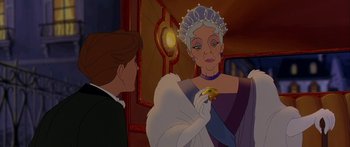 Movie still from “Anastasia” (1997), directed by Gary Goldman – A woman in a purple dress is talking to a man in a white suit; Close Up shot, Over the shoulder angle