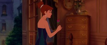 Movie still from “Anastasia” (1997), directed by Gary Goldman – A woman holding a rose in her hand; Medium shot, Over the shoulder angle