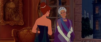 Movie still from “Anastasia” (1997), directed by Gary Goldman – Two women in formal wear standing next to each other in front of a window; Medium shot, Over the shoulder angle