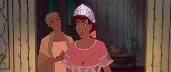 Movie still from “Anastasia” (1997), directed by Gary Goldman – A woman in a pink dress and a woman in a silver hat; Close Up shot, Over the shoulder angle
