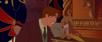 Movie still from “Anastasia” (1997), directed by Gary Goldman – A man in a suit and tie talking to a dog in front of him; Medium shot, Over the shoulder angle