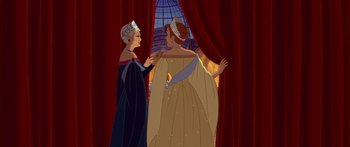 Movie still from “Anastasia” (1997), directed by Gary Goldman – Two women dressed in medieval clothing standing next to each other in front of a window; Medium shot, Over the shoulder angle