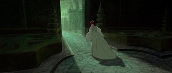 Movie still from “Anastasia” (1997), directed by Gary Goldman – A woman walking down a path in a green forest; Wide shot, High angle
