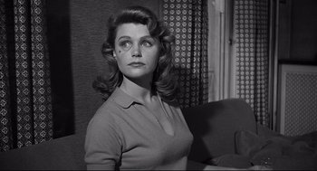 Movie still from “Anatomy of a Murder” (1959), directed by Otto Preminger – A black and white photo of a woman in a room; Close Up shot, Low angle