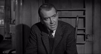 Movie still from “Anatomy of a Murder” (1959), directed by Otto Preminger – An older man in a suit and tie; Close Up shot, Over the shoulder angle