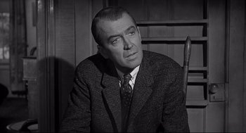 Movie still from “Anatomy of a Murder” (1959), directed by Otto Preminger – An older man in a suit and tie; Close Up shot, Low angle