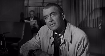 Movie still from “Anatomy of a Murder” (1959), directed by Otto Preminger – An older man wearing a jacket and a tie; Close Up shot, Over the shoulder angle
