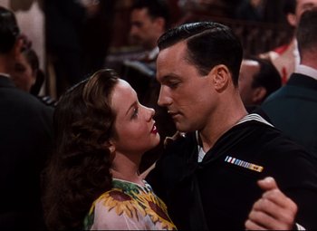 Movie still from “Anchors Aweigh” (1945), directed by Joseph Barbera – A man and a woman are dancing together; Close Up shot, Low angle