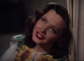 Movie still from “Anchors Aweigh” (1945), directed by Joseph Barbera – A beautiful woman with blue eyes wearing a floral shirt; Close Up shot, High angle