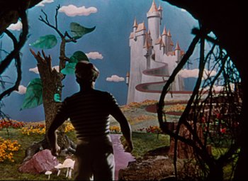 Movie still from “Anchors Aweigh” (1945), directed by Joseph Barbera – A man standing in front of an animated castle; Wide shot, High angle