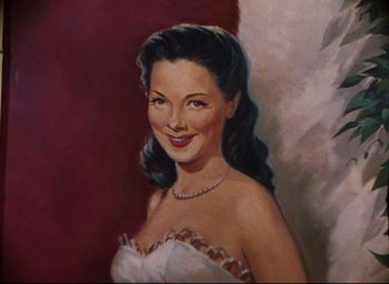 Movie still from “Anchors Aweigh” (1945), directed by Joseph Barbera – A painting of a beautiful woman in a white dress; Extreme Close Up shot, Overhead angle
