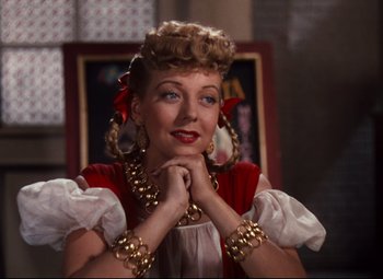 Movie still from “Anchors Aweigh” (1945), directed by Joseph Barbera – A person wearing a costume; Close Up shot, Over the shoulder angle