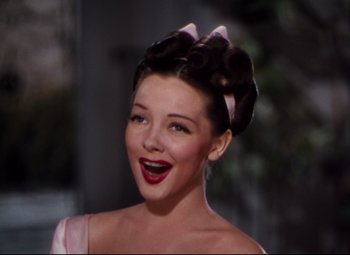 Movie still from “Anchors Aweigh” (1945), directed by Joseph Barbera – A person wearing a dress; Close Up shot, Low angle