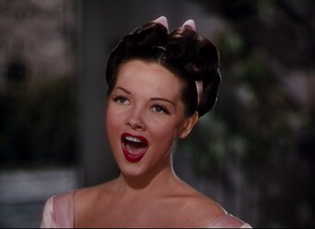 Movie still from “Anchors Aweigh” (1945), directed by Joseph Barbera – A person wearing a dress; Close Up shot, Low angle