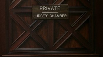 Movie still from “And Justice for All” (1979), directed by Norman Jewison – A sign on a door; Wide shot, High angle