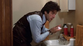 Movie still from “And Justice for All” (1979), directed by Norman Jewison – A man is washing his hands in the bathroom; Close Up shot, Low angle