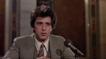 Movie still from “And Justice for All” (1979), directed by Norman Jewison – A person wearing a suit and tie; Close Up shot, Low angle