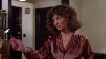 Movie still from “And Justice for All” (1979), directed by Norman Jewison – A person wearing a brown shirt; Close Up shot, Over the shoulder angle