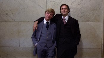 Movie still from “And Justice for All” (1979), directed by Norman Jewison – A couple of men standing next to each other; Medium shot, Low angle