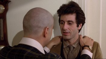 Movie still from “And Justice for All” (1979), directed by Norman Jewison – A man adjusting another man's tie in front of a mirror; Close Up shot, Over the shoulder angle